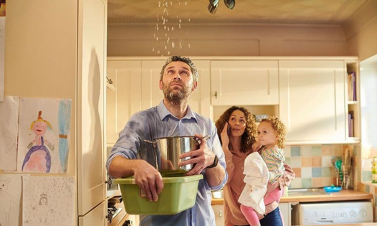 66e31c63624223863c2c5641_6668f4d311a9ff18f8489d4c_family-with-leaking-kitchen-roof.jpeg