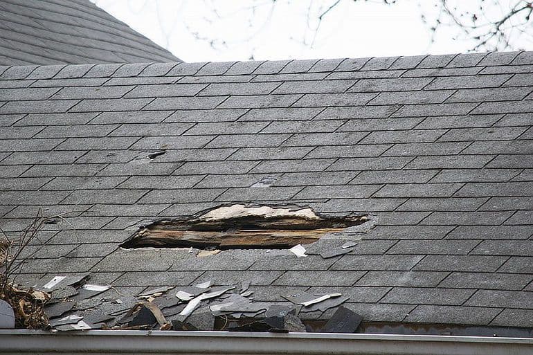 66e31c63624223863c2c564a_6668f4d3882cdb0ec44278c7_hole-in-asphalt-roof.jpeg