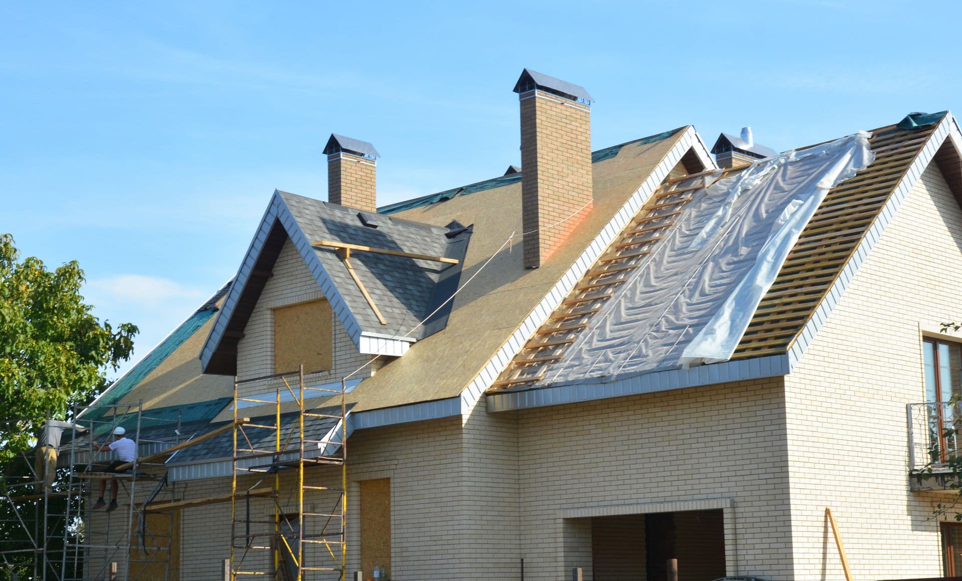 bigstock-Roofing-Contractors-Installing-330621523.jpg