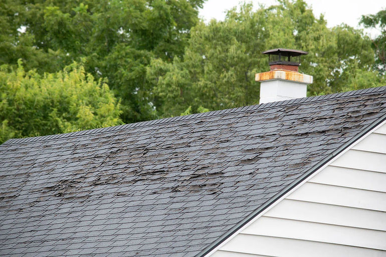 Missing asphalt shingles on a roof